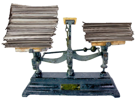 Old Fashioned Balance Scale weighing piles of paper
